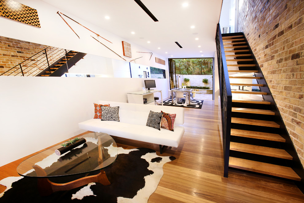 Design ideas for a mid-sized transitional wood floating staircase in Sydney.