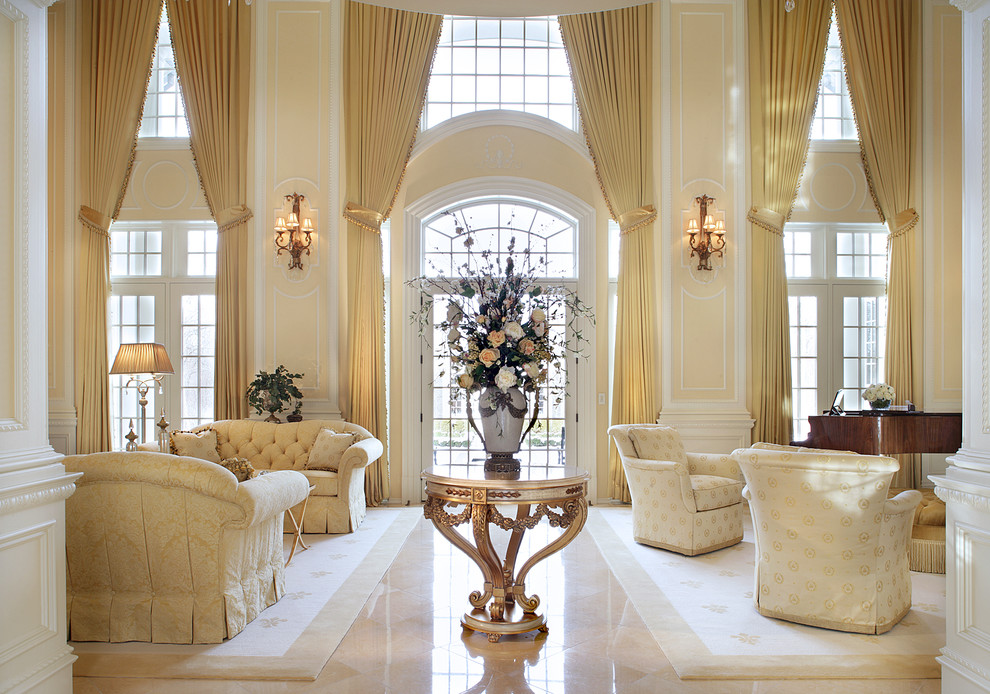 This is an example of an expansive traditional living room in New York with a music area, beige walls and beige floor.