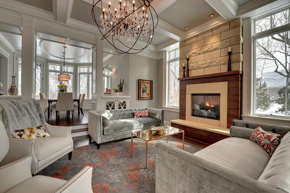 Traditional living room in Minneapolis with grey walls and a standard fireplace.