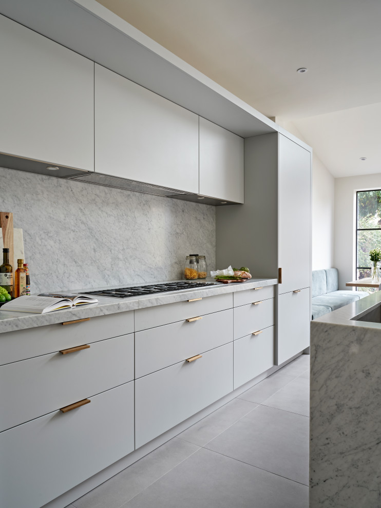 Photo of a mid-sized midcentury single-wall eat-in kitchen in London with an undermount sink, flat-panel cabinets, grey cabinets, marble benchtops, grey splashback, marble splashback, black appliances, with island, grey floor and grey benchtop.