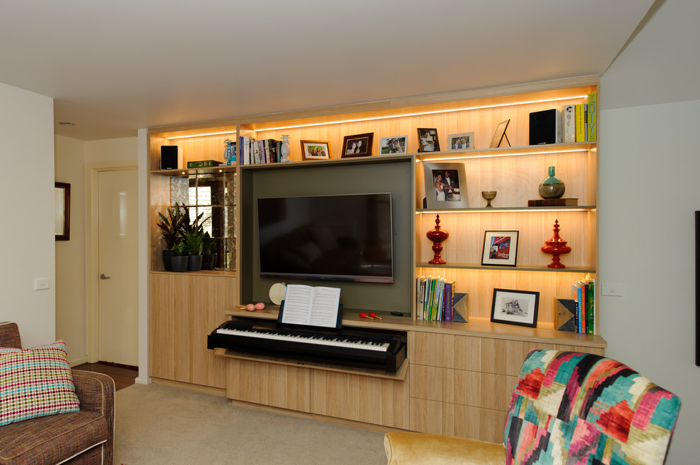 Mid-sized contemporary open concept living room in Sydney with a music area, grey walls, carpet, a standard fireplace, a concrete fireplace surround, a built-in media wall and beige floor.