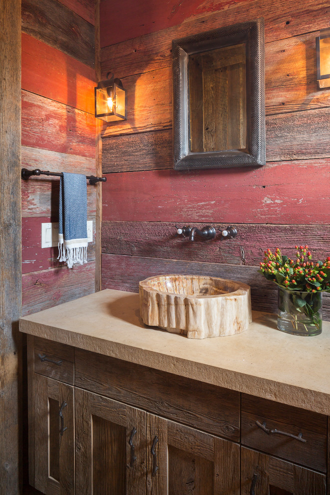 Country bathroom in Austin with a vessel sink, shaker cabinets, dark wood cabinets and red walls.