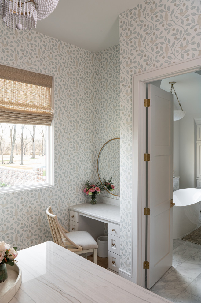 Inspiration for a mid-sized cottage women's walk-in closet remodel in Houston with shaker cabinets and white cabinets