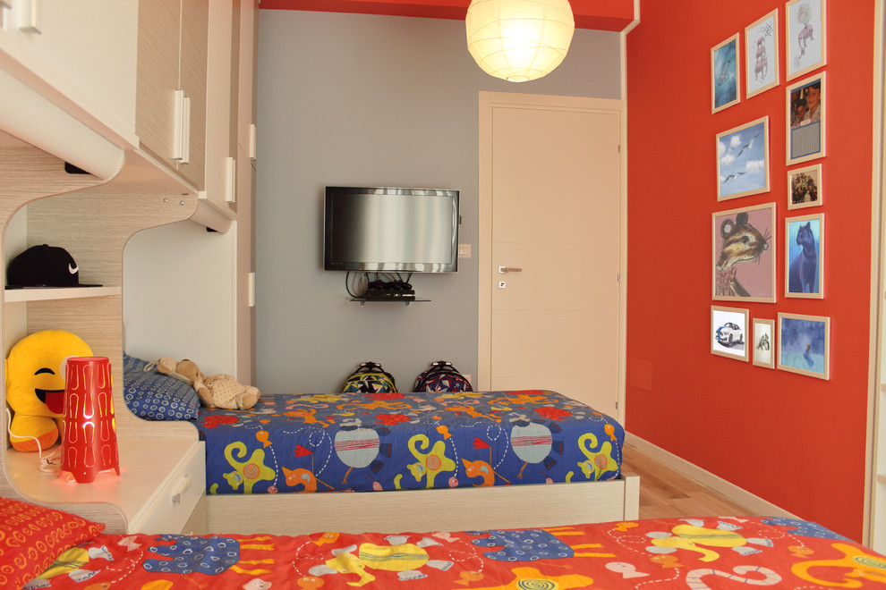 This is an example of a large contemporary kids' room for boys in Bari with red walls and porcelain floors.