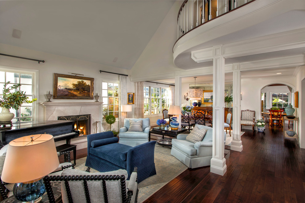 Inspiration for a mid-sized transitional formal open concept living room in Orange County with white walls, dark hardwood floors, a stone fireplace surround and a standard fireplace.
