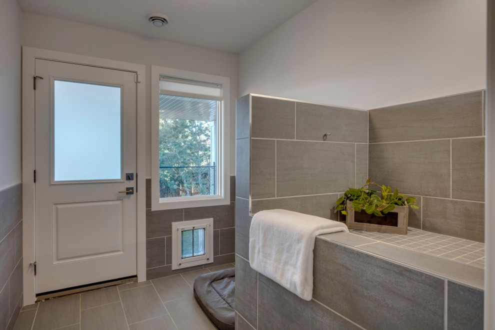 Example of a transitional home design design in Calgary