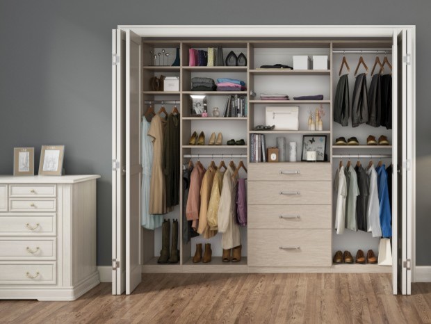 Photo of a traditional gender neutral standard wardrobe in Los Angeles with flat-panel cabinets, white cabinets and concrete flooring.