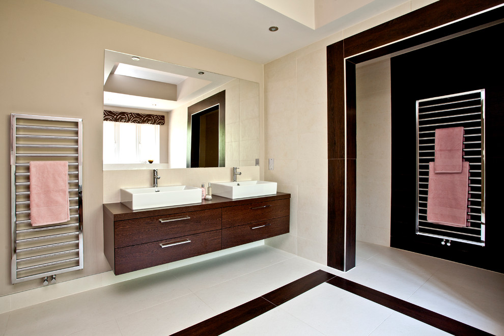 Large contemporary master bathroom in Dorset with an open shower, a wall-mount toilet and beige tile.