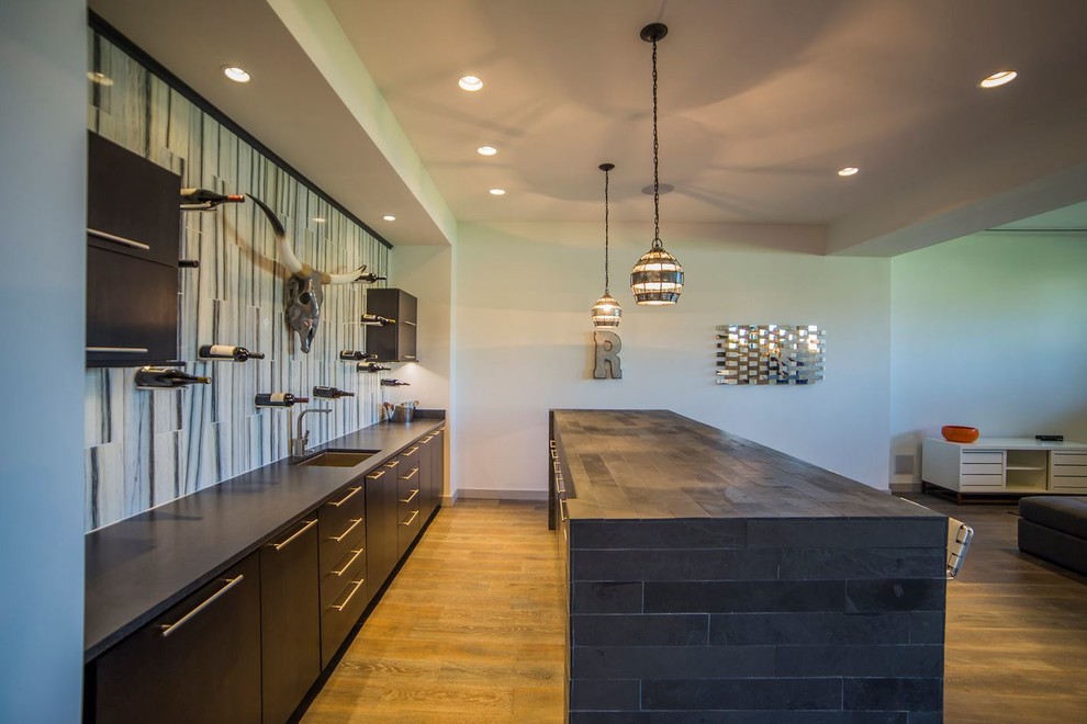 Inspiration for a large transitional walk-out dark wood floor basement remodel in Chicago with white walls