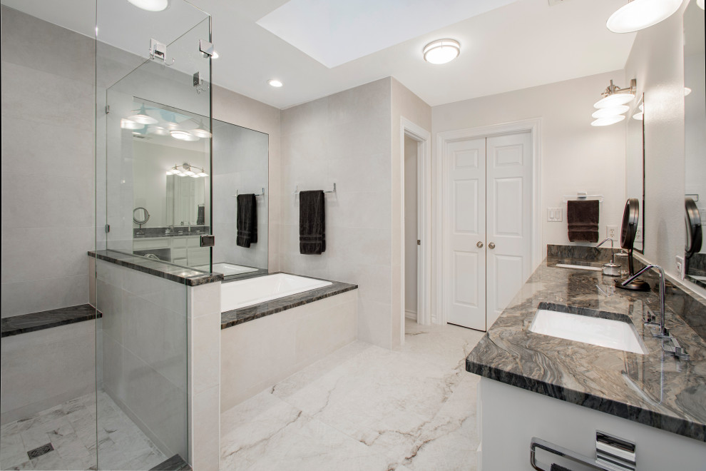 Photo of a mid-sized modern master bathroom in Dallas with flat-panel cabinets, white cabinets, an alcove tub, a corner shower, a two-piece toilet, white tile, beige walls, an undermount sink, quartzite benchtops, white floor, a hinged shower door, grey benchtops, a double vanity and a built-in vanity.