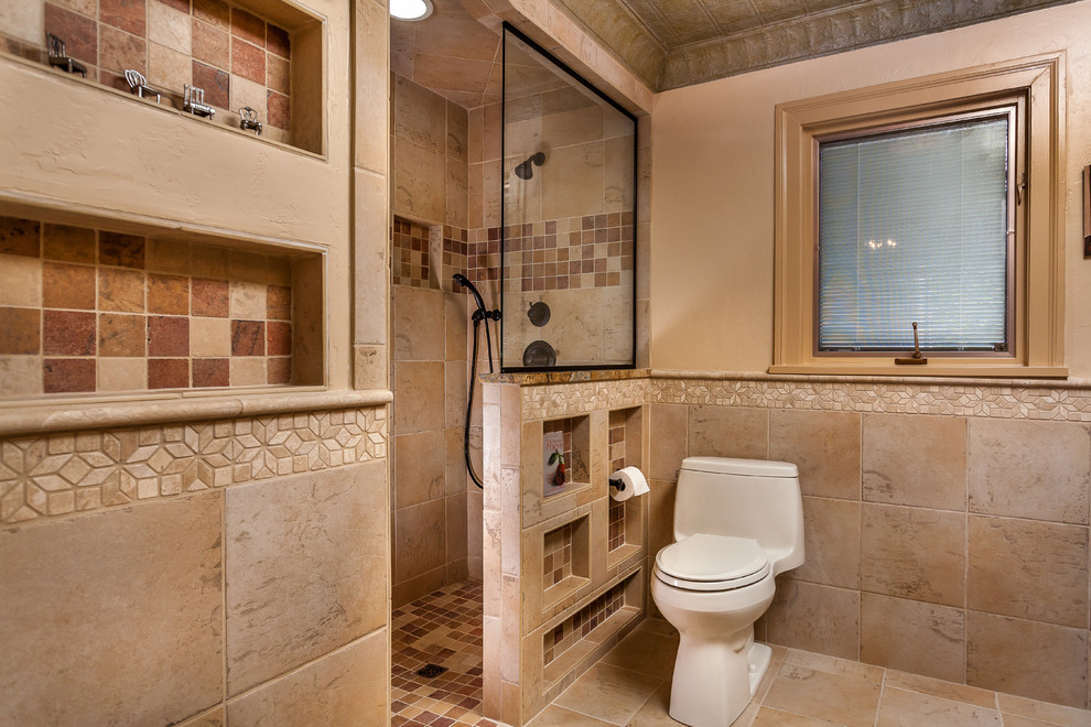 This is an example of a small 3/4 bathroom in Dallas with a curbless shower, a one-piece toilet, beige tile, porcelain tile, brown walls and ceramic floors.