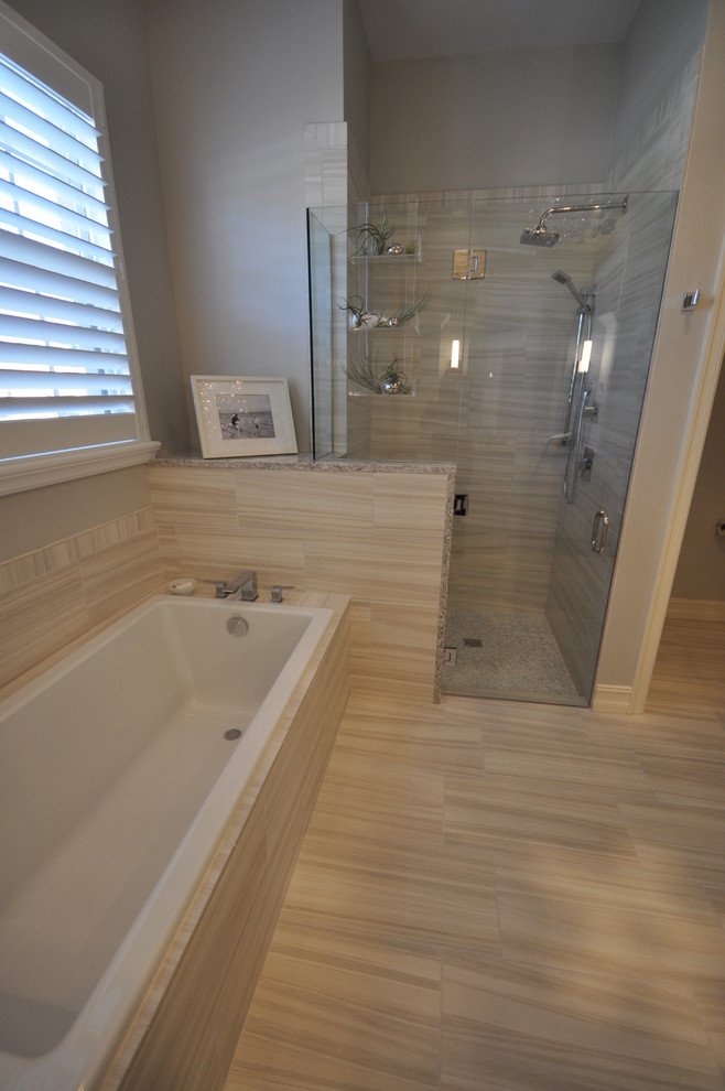 Example of a mid-sized transitional master gray tile and porcelain tile porcelain tile drop-in bathtub design in Miami with shaker cabinets, white cabinets, gray walls, quartz countertops, an undermount sink and a two-piece toilet