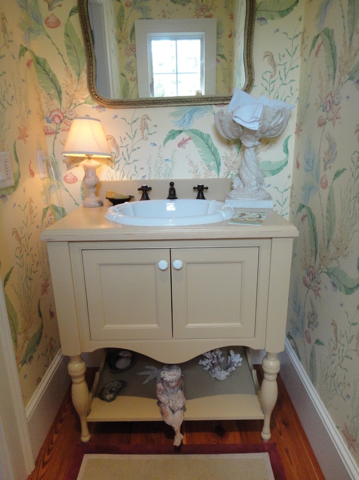 This is an example of a beach style powder room in Boston.