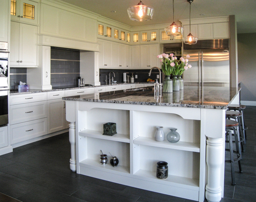Example of a transitional l-shaped gray floor eat-in kitchen design in Toronto with an undermount sink, white cabinets, granite countertops, gray backsplash, stainless steel appliances and an island