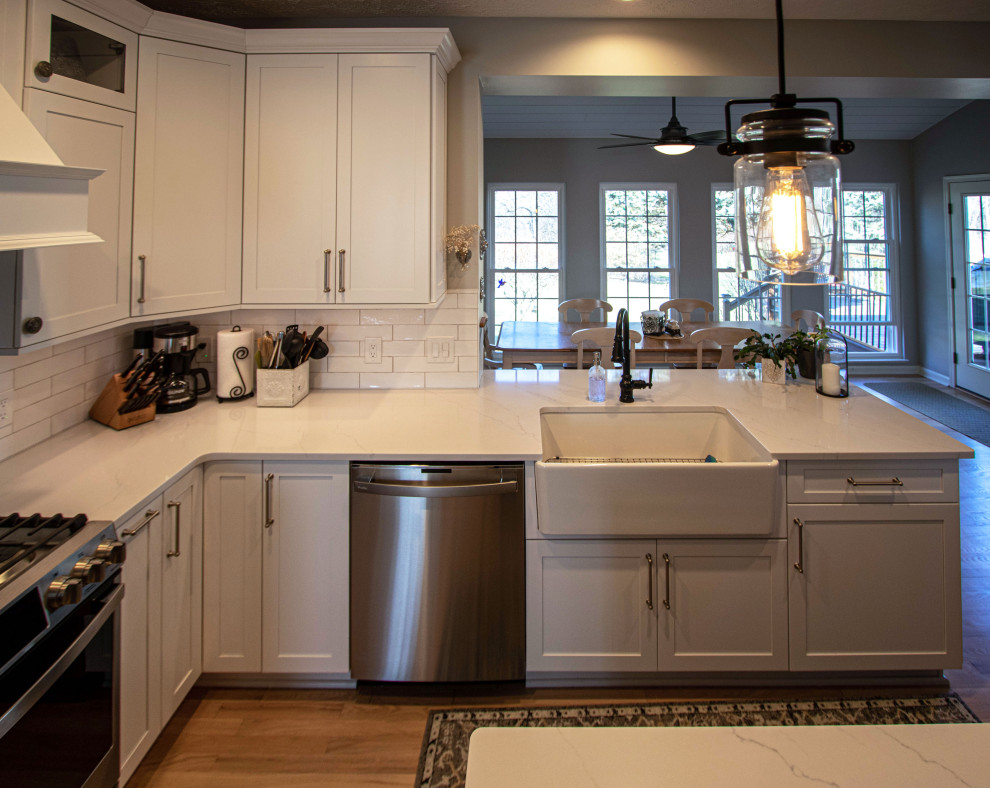 Siteline White Kitchen with Gray Island and Calacatta Miraggio Quartz ...