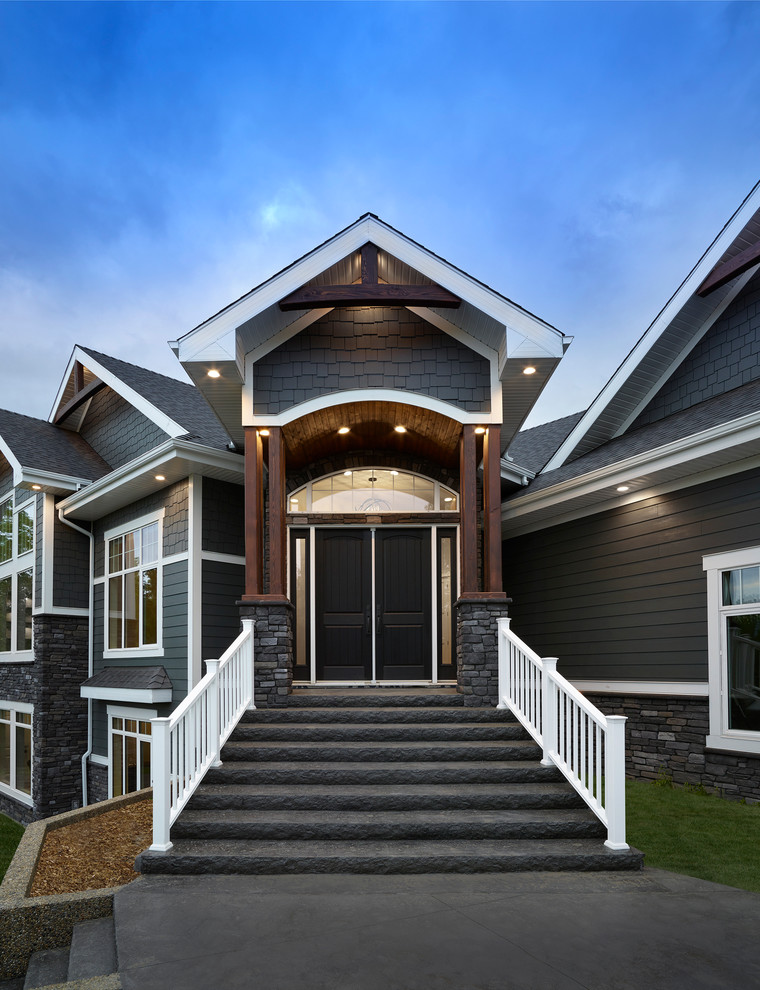 Inspiration for a mid-sized modern one-storey grey exterior in Edmonton with mixed siding.