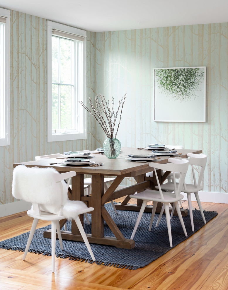 Inspiration for a beach style dining room in Providence with green walls, medium hardwood floors and brown floor.