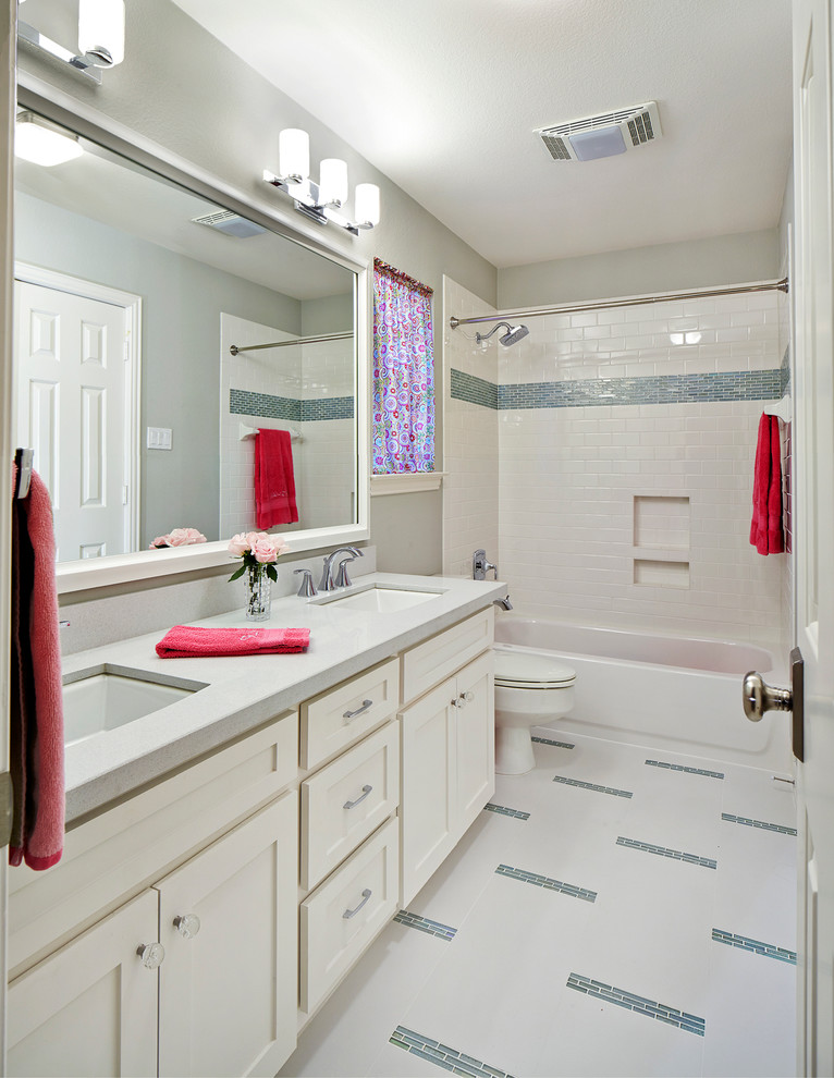 Design ideas for a transitional bathroom in Other with recessed-panel cabinets, white cabinets, an alcove tub, a shower/bathtub combo, multi-coloured floor and a shower curtain.