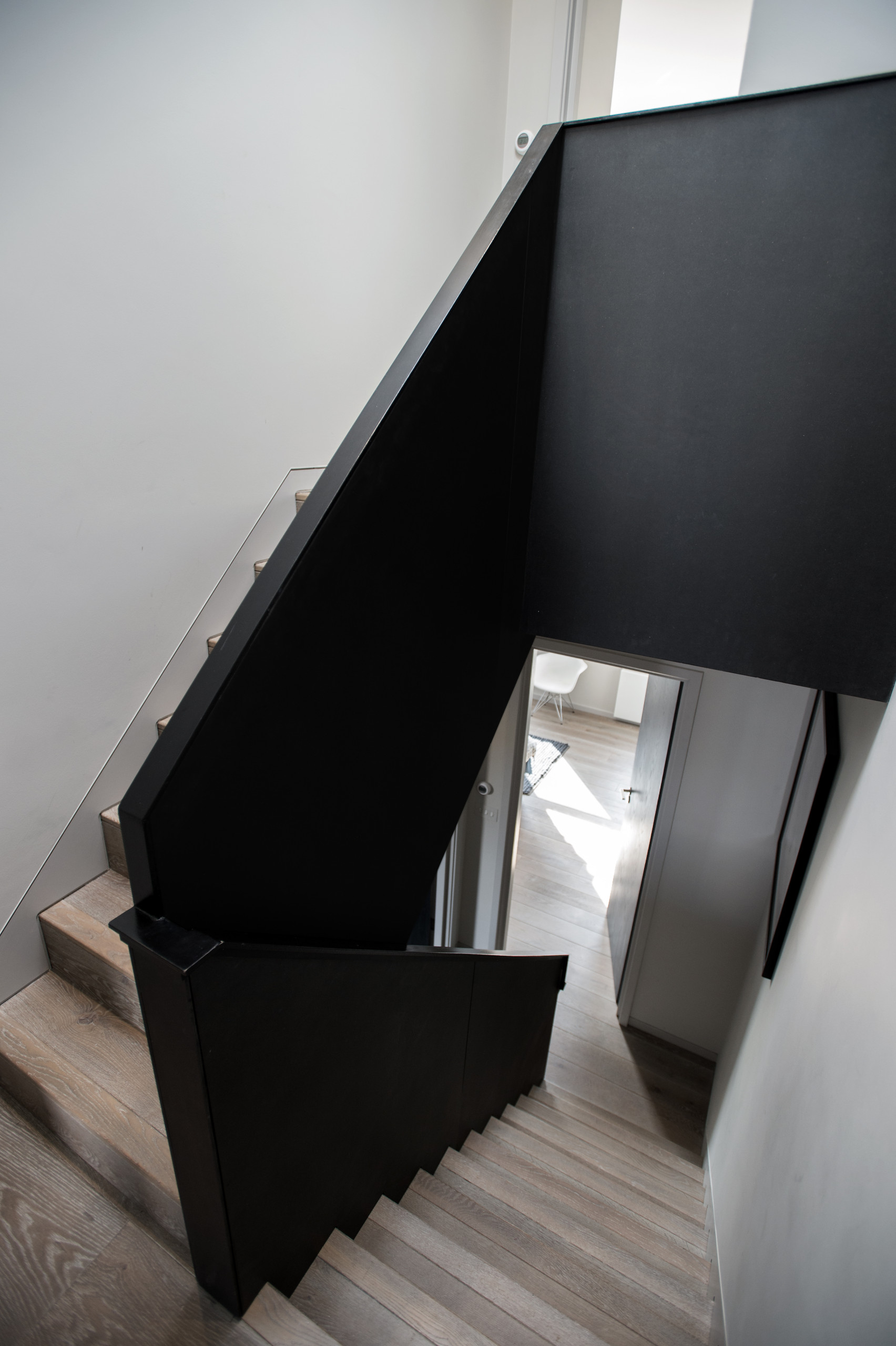 new staircases cladded with beautiful oak flooring, super-modern balustrade, ultra-modern skirting board