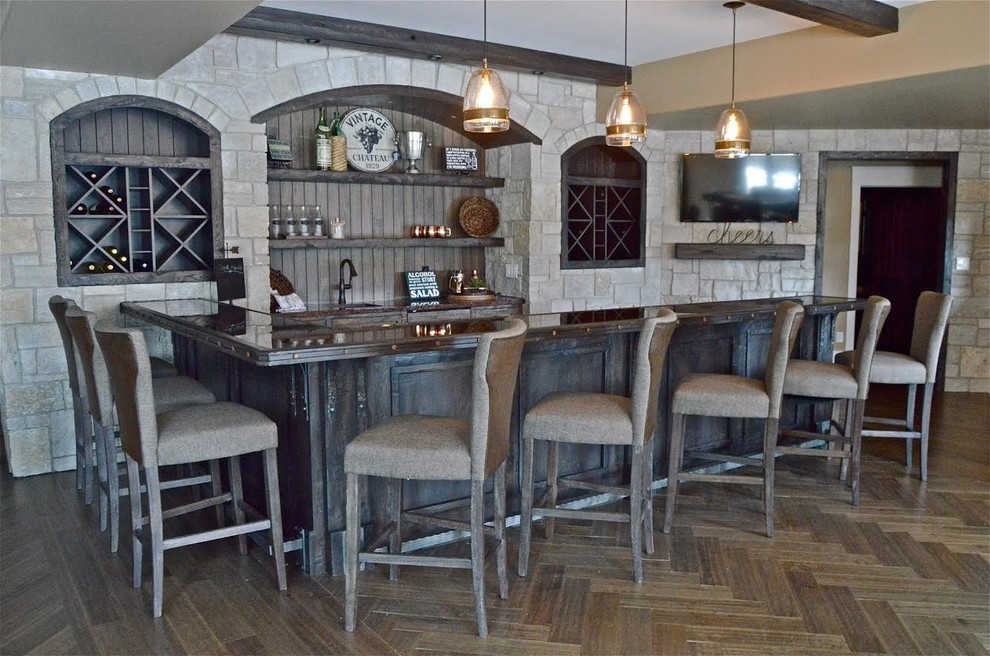 Large traditional single-wall seated home bar in Chicago with an undermount sink, shaker cabinets, black cabinets, granite benchtops, grey splashback, timber splashback and dark hardwood floors.