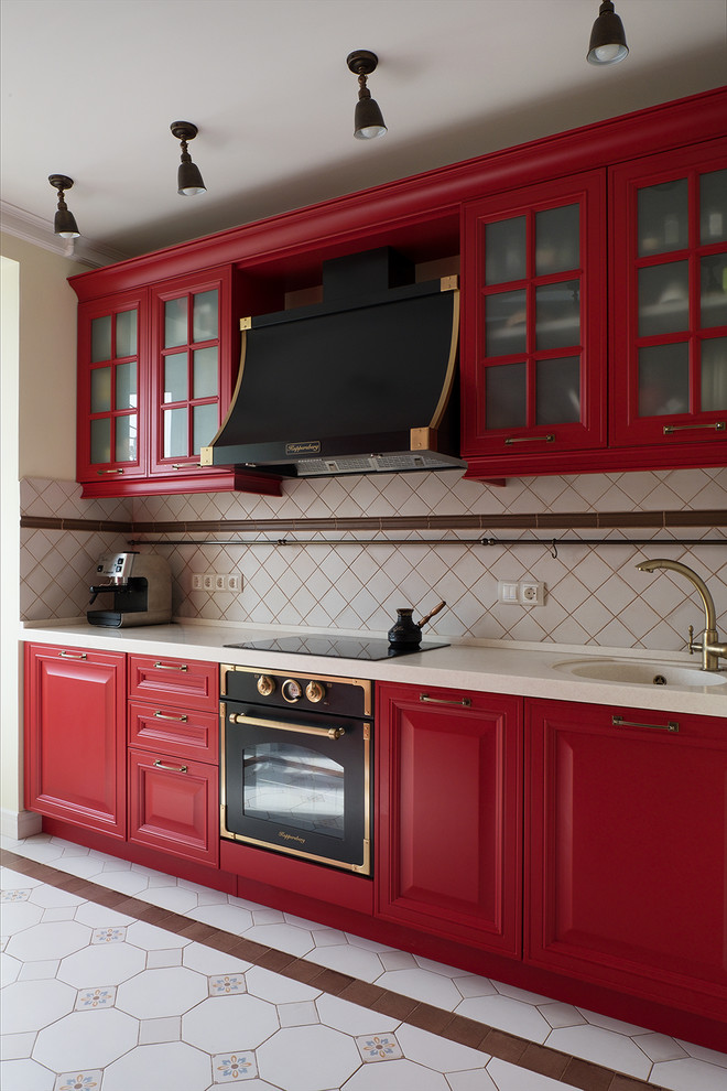 Photo of a contemporary single-wall kitchen in Moscow with an integrated sink, raised-panel cabinets, red cabinets, beige splashback, coloured appliances, no island, white floor and white benchtop.