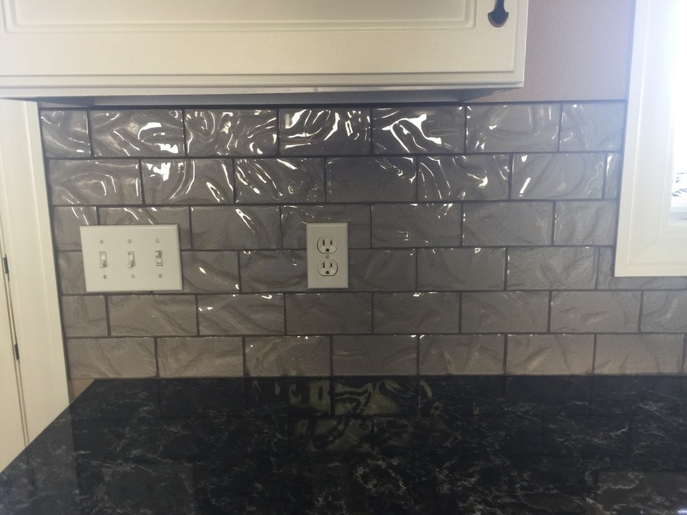 Inspiration for a transitional kitchen remodel with gray backsplash and glass tile backsplash