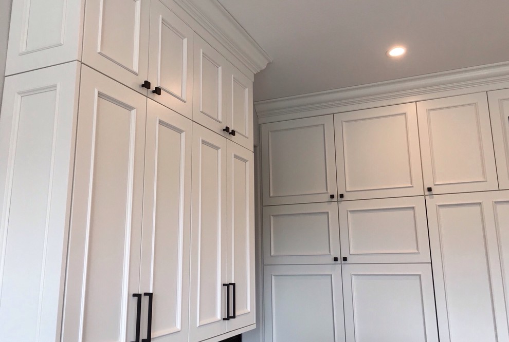 Inspiration for a large transitional home design remodel in Phoenix with recessed-panel cabinets, white cabinets, granite countertops and an island