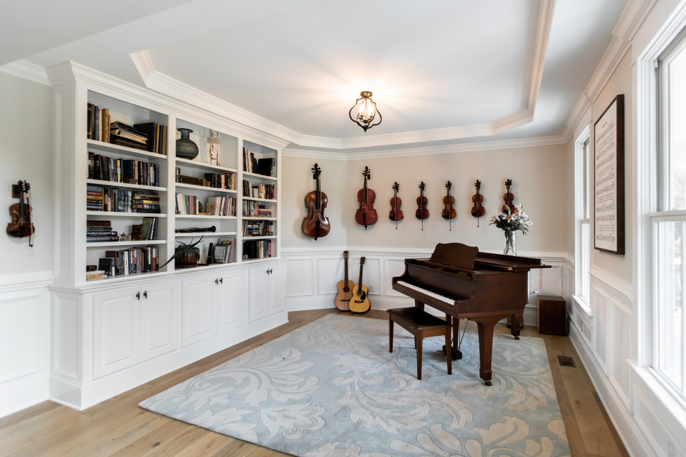 Inspiration for a medium sized classic open plan games room in Charleston with a music area, beige walls and medium hardwood flooring.