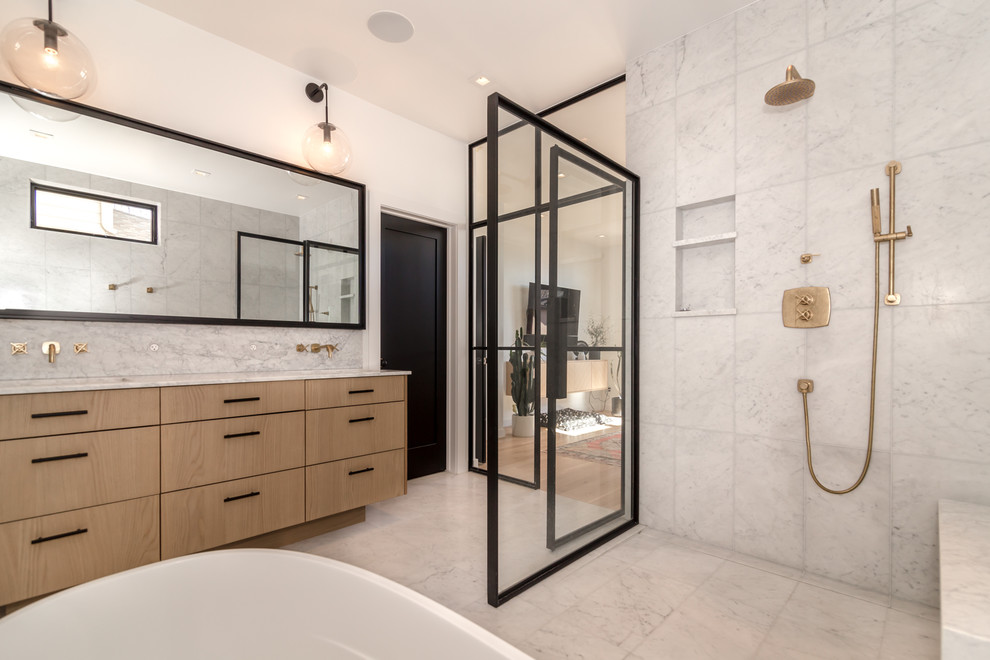 This is an example of a mid-sized midcentury master bathroom in Denver with marble floors and an open shower.