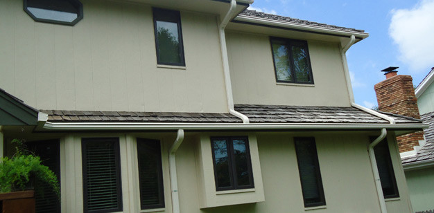 Photo of a large traditional two-storey beige exterior in Minneapolis.