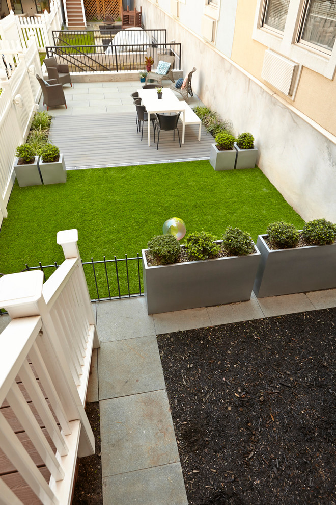 This is an example of a small contemporary backyard shaded outdoor sport court for spring in New York with mulch.