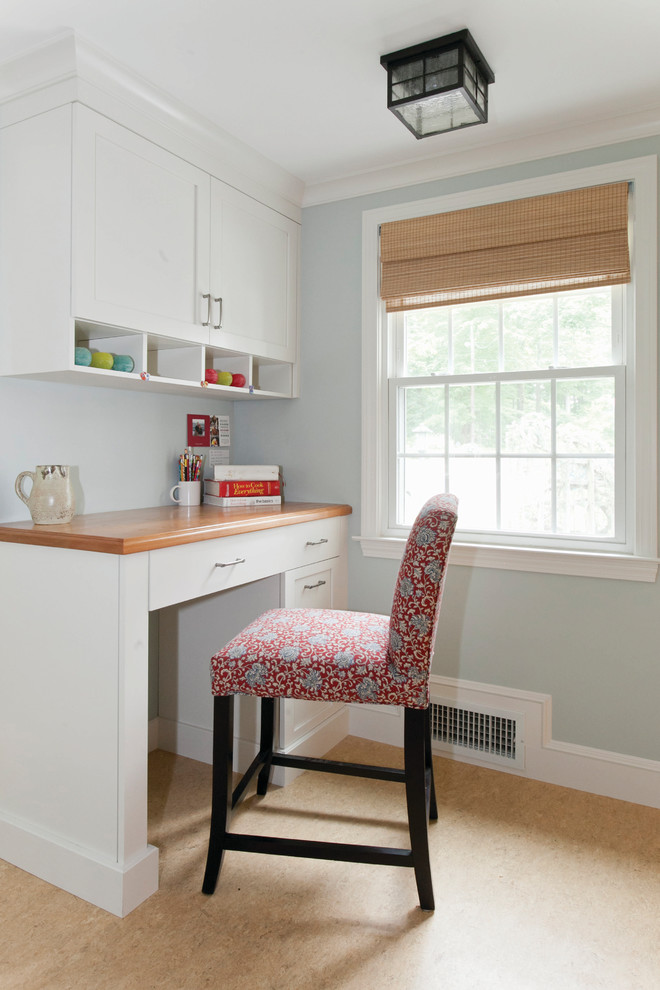 Photo of a small traditional study room in Raleigh with grey walls, light hardwood floors, no fireplace, a built-in desk and beige floor.