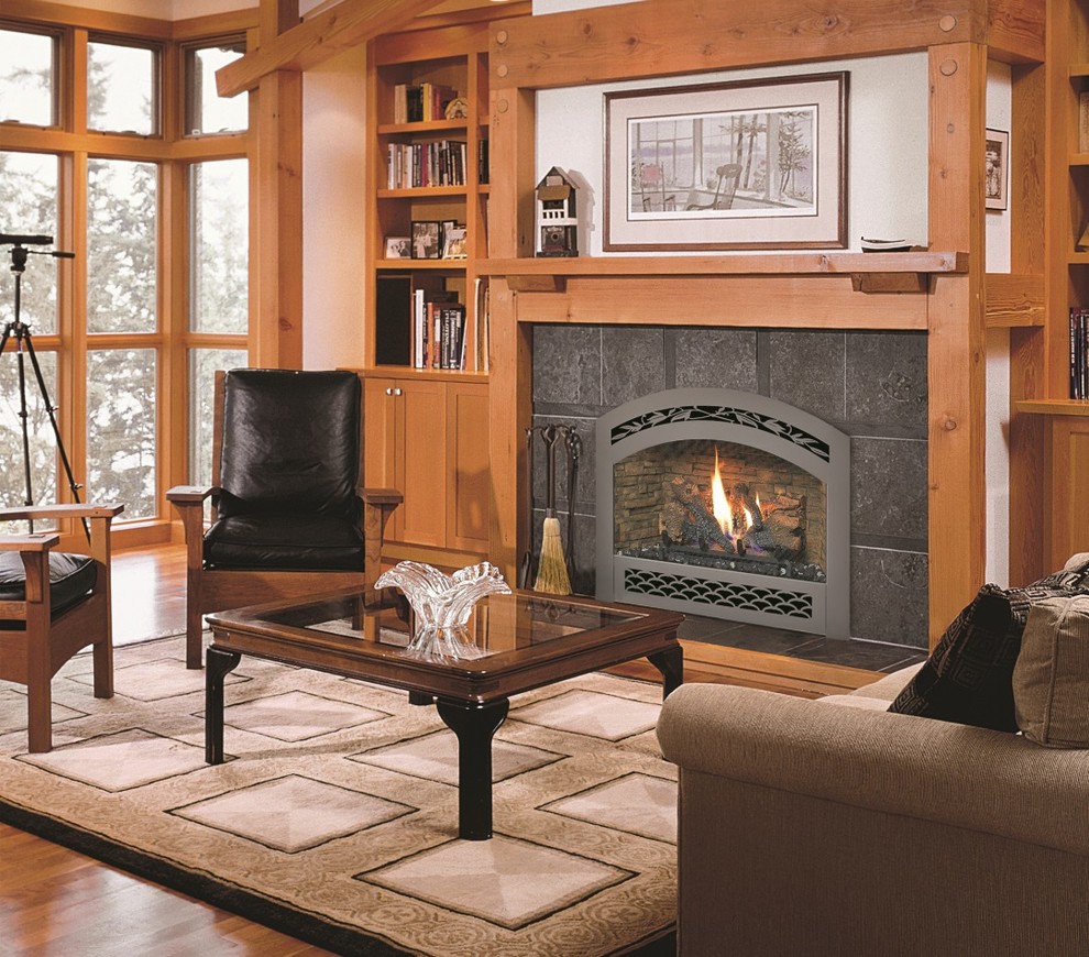 Design ideas for a mid-sized country formal enclosed living room in Dallas with beige walls, medium hardwood floors, a standard fireplace, a tile fireplace surround, no tv and brown floor.