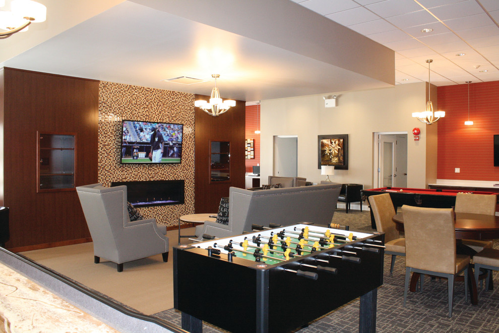 Example of a minimalist open concept ceramic tile game room design in New York with a standard fireplace and a wall-mounted tv