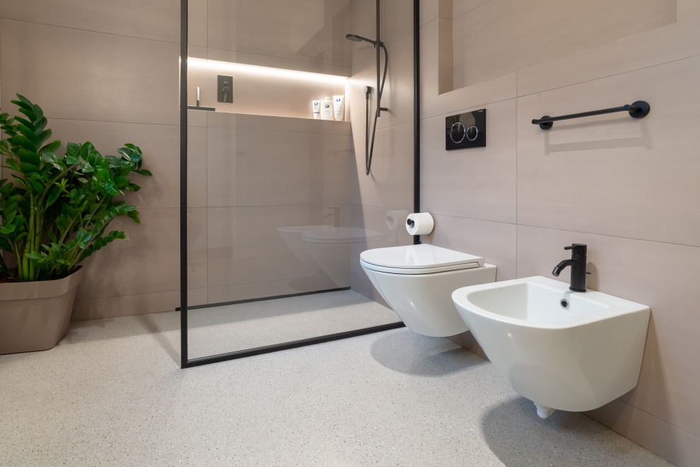 Large modern 3/4 bathroom in Venice with black cabinets, an open shower, a wall-mount toilet, pink tile, white walls, concrete floors, grey floor, an open shower, a single vanity and a floating vanity.