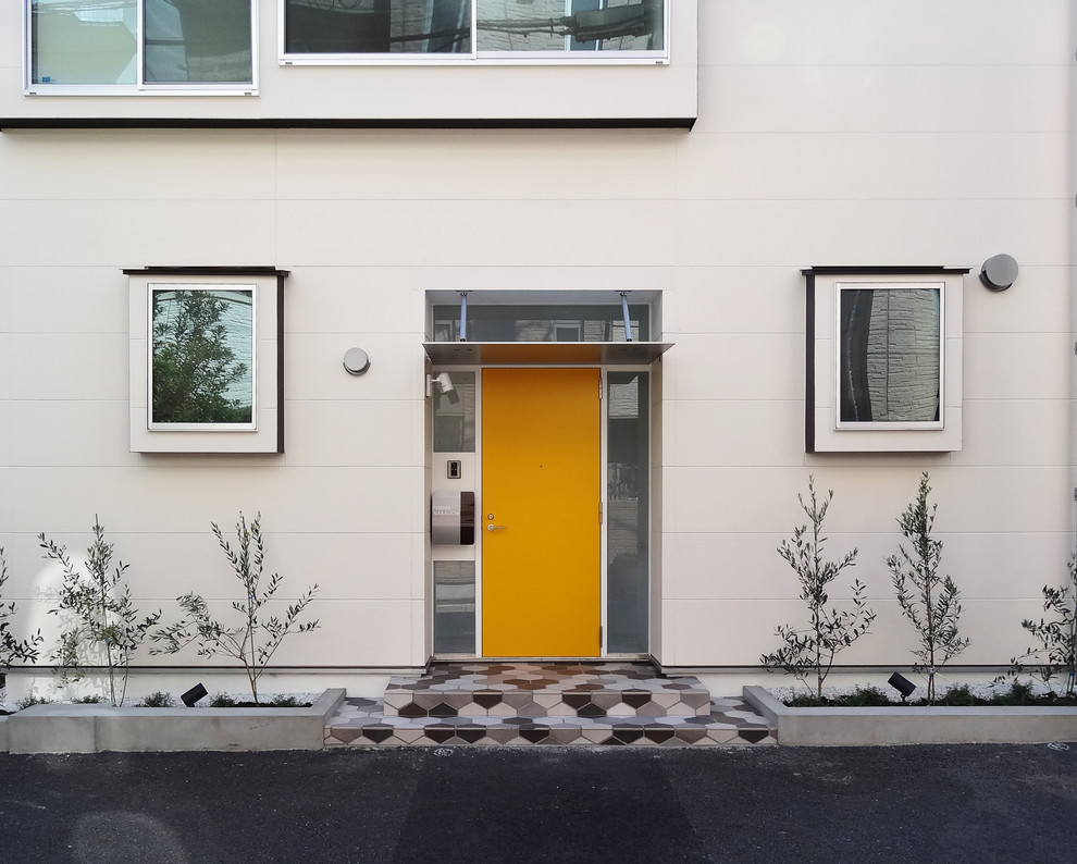 東京23区にある中くらいなモダンスタイルのおしゃれな二階建ての家 (コンクリート繊維板サイディング) の写真