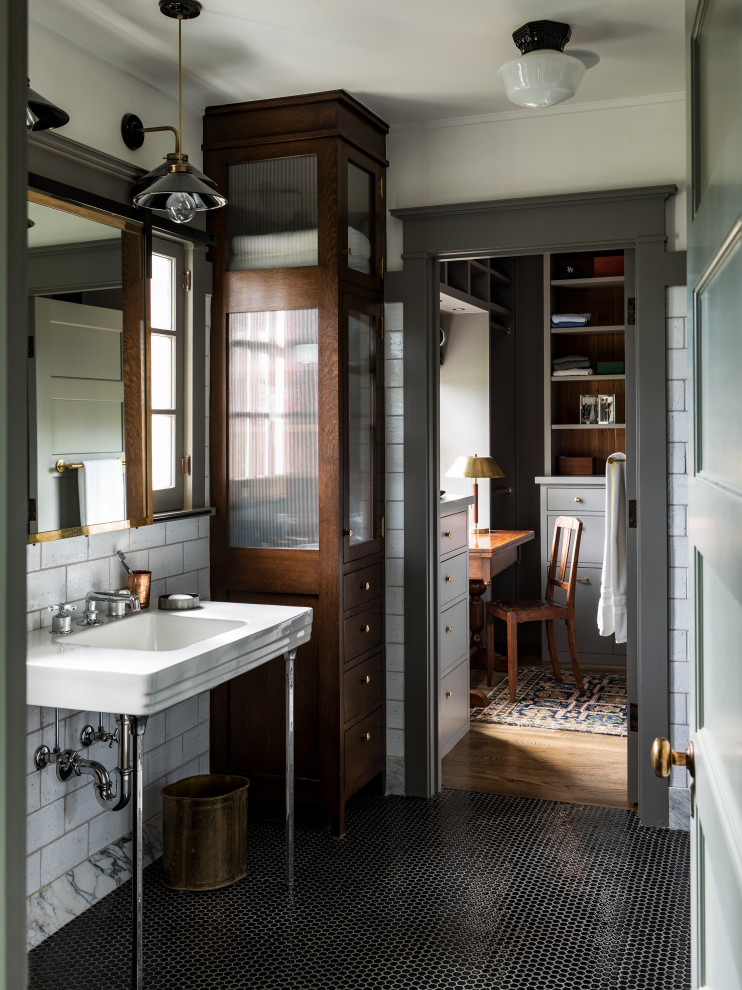 Inspiration for an arts and crafts master bathroom in Los Angeles with white tile, white walls, a pedestal sink, black floor and white benchtops.