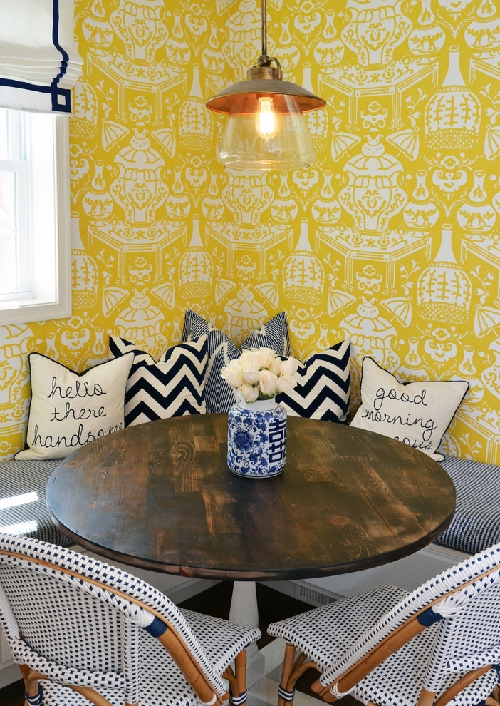 This is an example of a transitional dining room in DC Metro with yellow walls.
