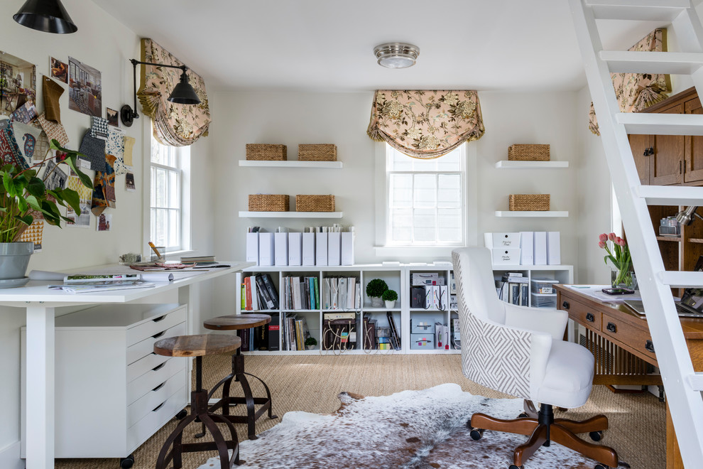 Small transitional home office in Boston with white walls and a freestanding desk.