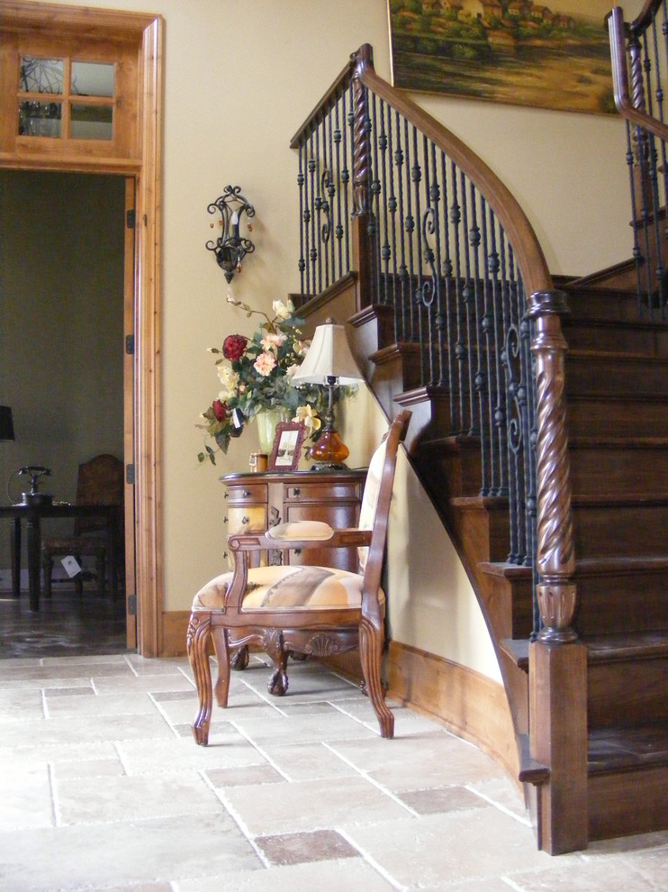Inspiration for a large mediterranean wood u-shaped staircase in Seattle with wood risers.