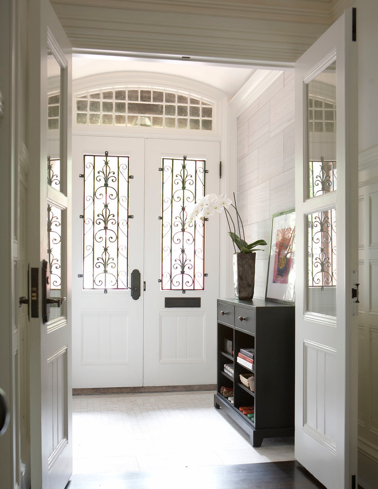 Large traditional foyer in Boston with white walls, marble floors, a double front door, a white front door and white floor.
