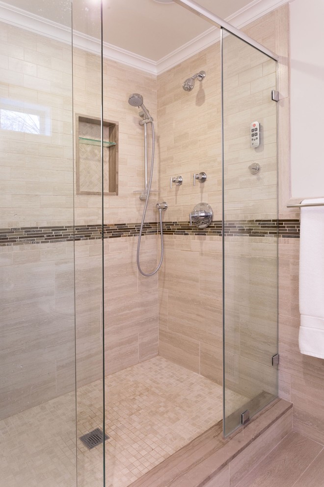 This is an example of a mid-sized transitional master bathroom in New York with flat-panel cabinets, dark wood cabinets, a double shower, a one-piece toilet, beige tile, porcelain tile, grey walls, porcelain floors, an integrated sink and laminate benchtops.
