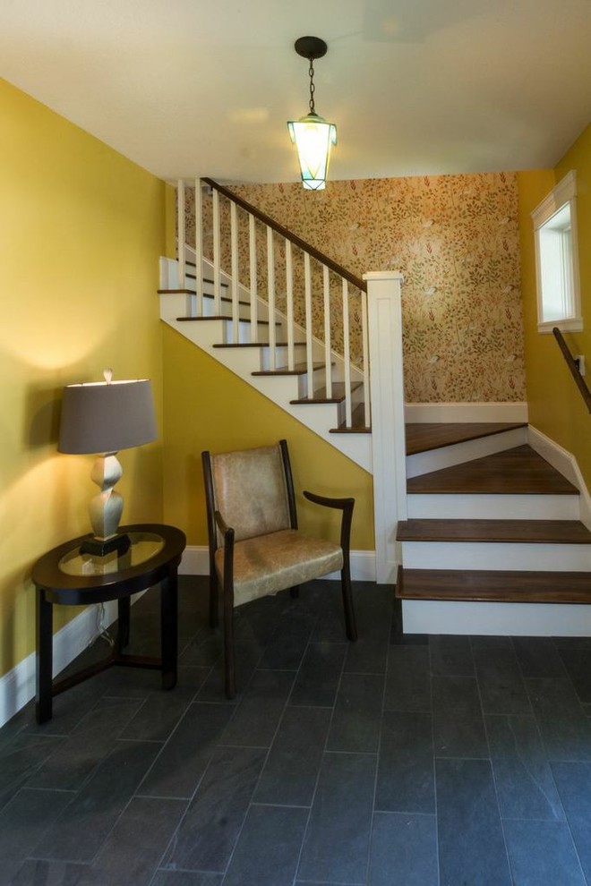 Foyer - mid-sized traditional slate floor foyer idea with yellow walls