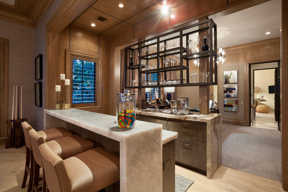 Inspiration for an expansive transitional home bar in Miami.