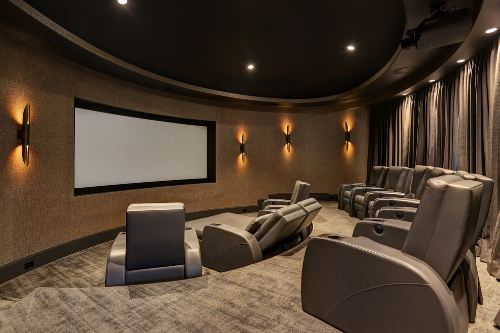 This is an example of a transitional enclosed home theatre in Houston with brown walls, carpet and grey floor.
