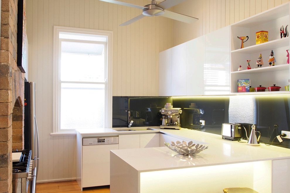 Contemporary separate kitchen in Brisbane with flat-panel cabinets and white cabinets.