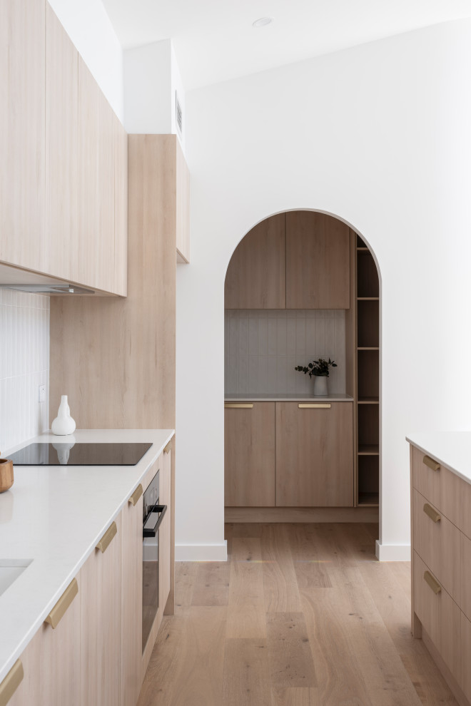 This is an example of a contemporary kitchen in Wollongong.