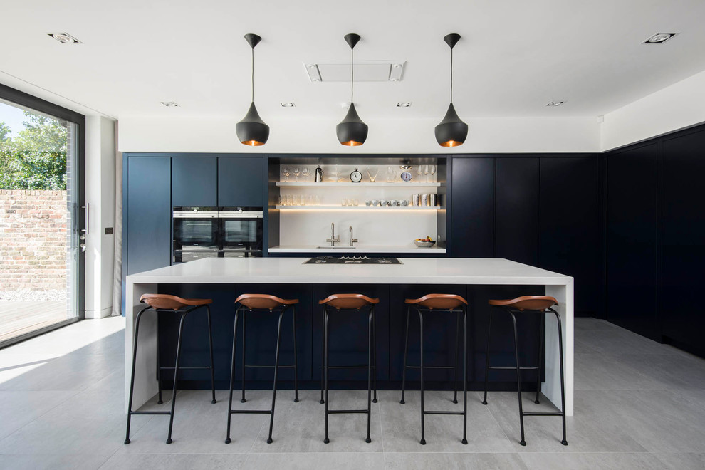 Inspiration for a contemporary kitchen in Other with an undermount sink, flat-panel cabinets, white splashback, black appliances and with island.