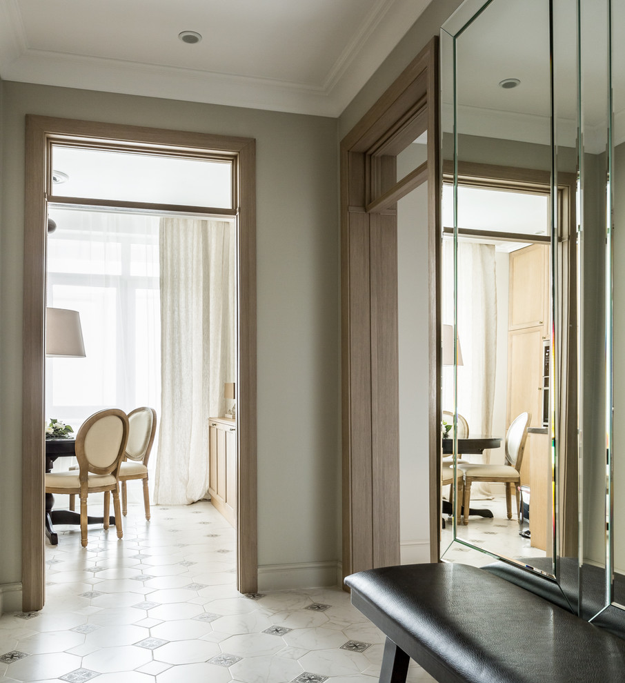 This is an example of a transitional hallway in Moscow with grey walls, porcelain floors and white floor.