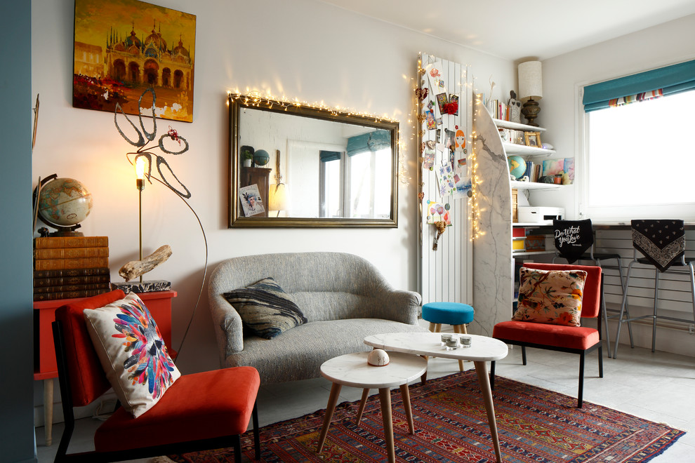 Photo of a small eclectic enclosed living room in Paris with white walls, ceramic floors, no fireplace, no tv and grey floor.